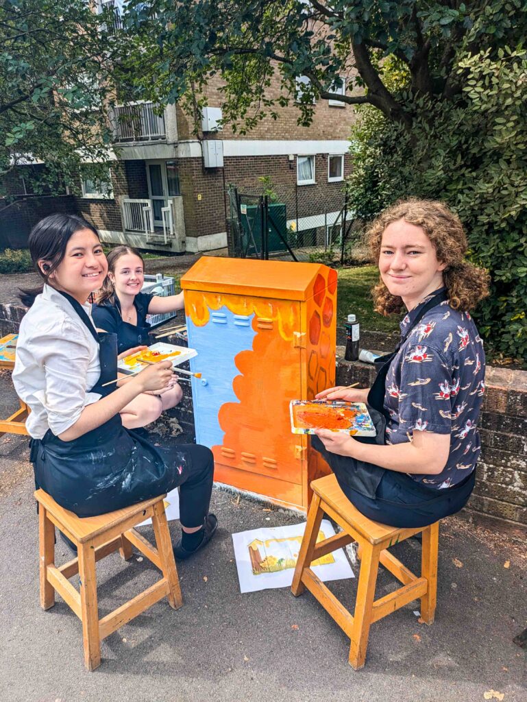 The girls creating some street art