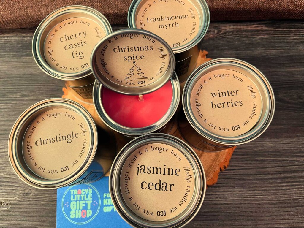 Scented candle tins in festive fragrances, including Christmas spice and winter berries, for Balcombe Christmas Crafts, Gifts & Produce Fair.