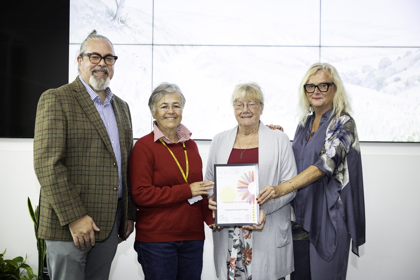 Haywards Heath in Bloom representatives receive their award at the 2026 South & South East in Bloom ceremony