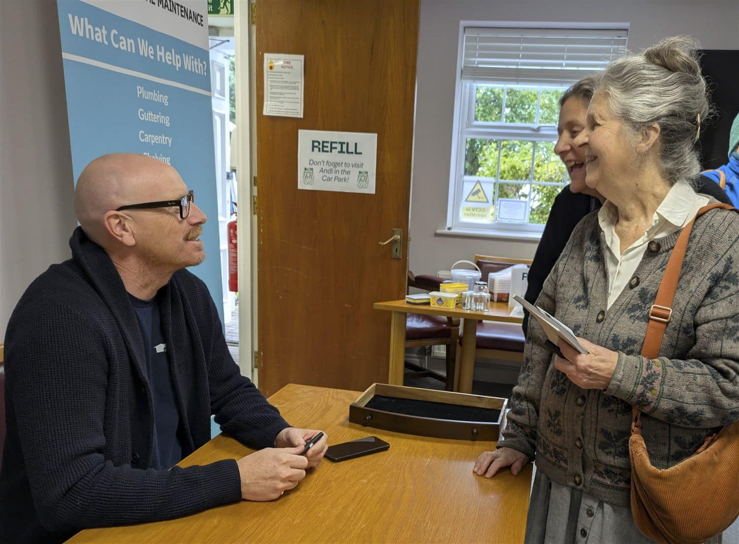Visitors chatting with a volunteer at the New Leaf Fixing Station in Haywards Heath Town Hall